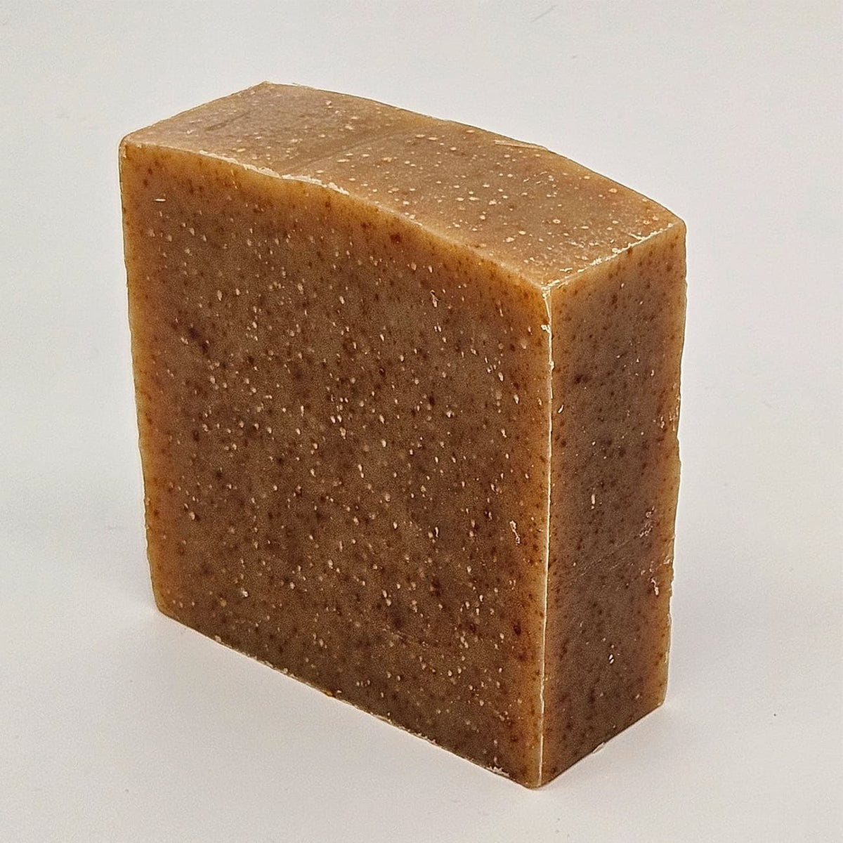 Unboxed bar of Allfather natural handmade soap with aloe, honey and crushed blackberry seed