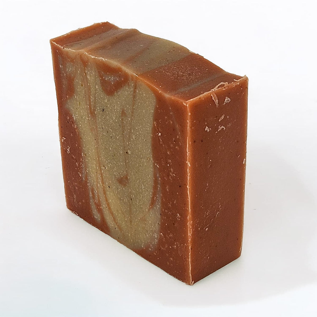 Unboxed bar of Dead Head natural handmade soap, a Grateful Dead-inspired bar with red kernel cornmeal and Moroccan red clay