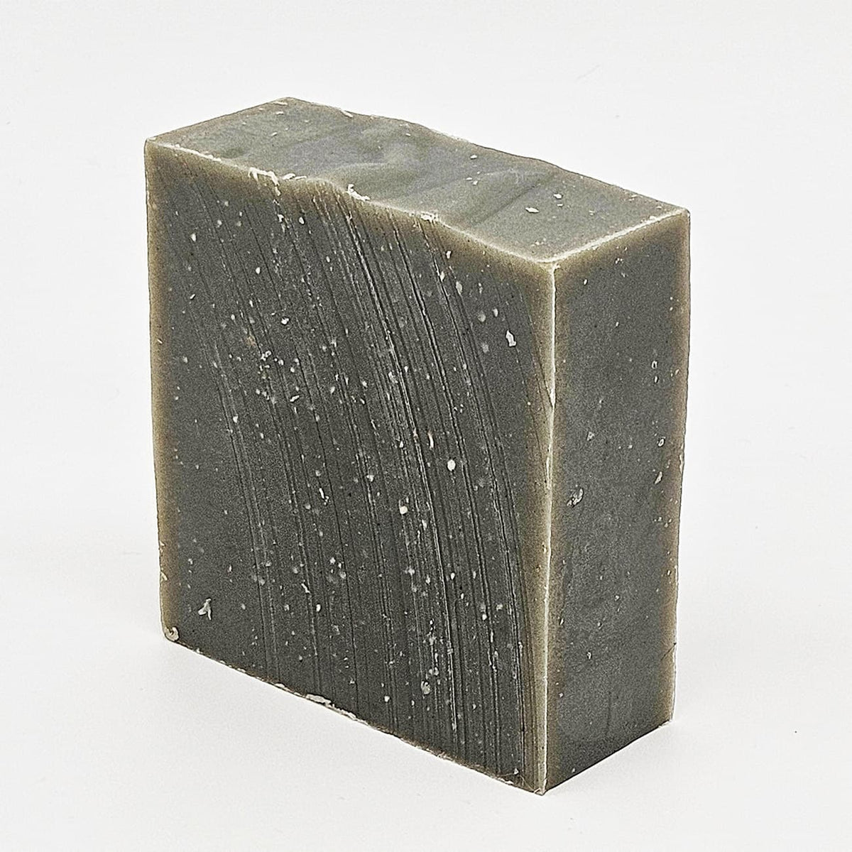 Unboxed bar of Holy Ghost natural handmade soap, a cathedral-incense bar scrubbed with pumice and loofah
