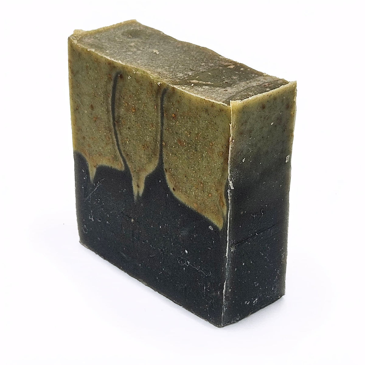 Unboxed bar of Krampus & Kringle natural handmade soap, a limited-edition Christmas bar with crushed candy cane and activated charcoal