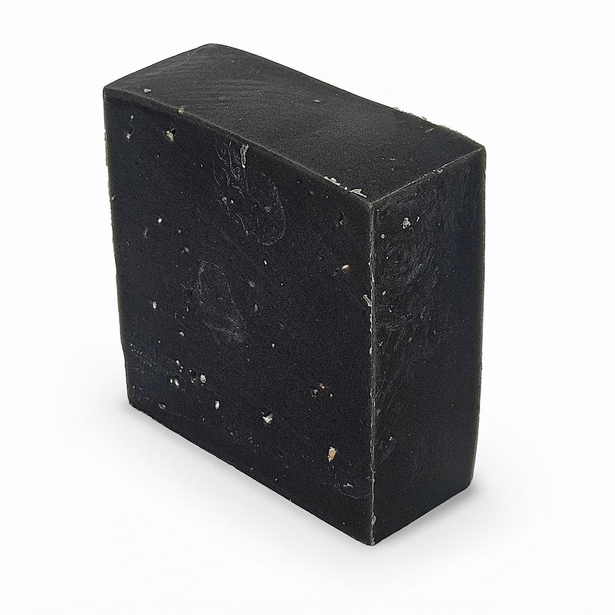 Unboxed bar of Northern Pine Tar natural handmade soap, a dark, resinous Viking-inspired bar with activated charcoal and pumice